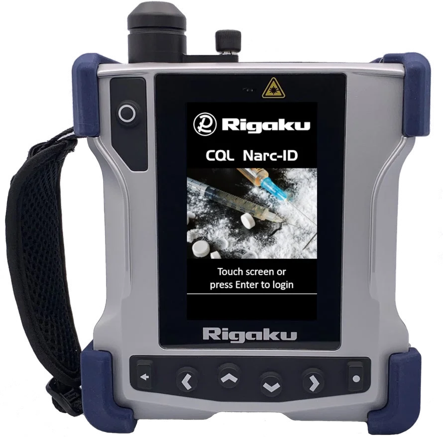 Rigaku CQL Narc-ID handheld Raman analyzer with blue bumpers and a CQL Narc-ID login screen