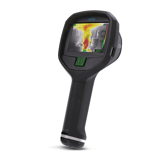 FLIR K33 thermal imaging camera, three-quarter view with the screen showing a room fire in thermal colours