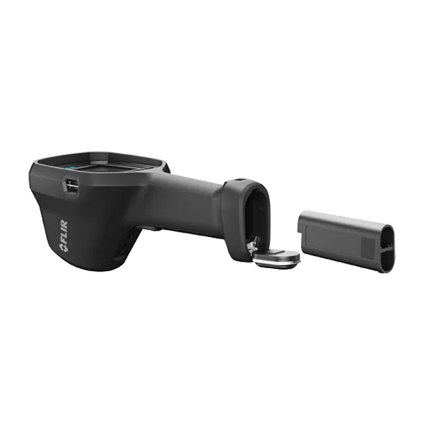 FLIR K85-N on its side with the battery door open and the Li-ion battery pack removed from the grip